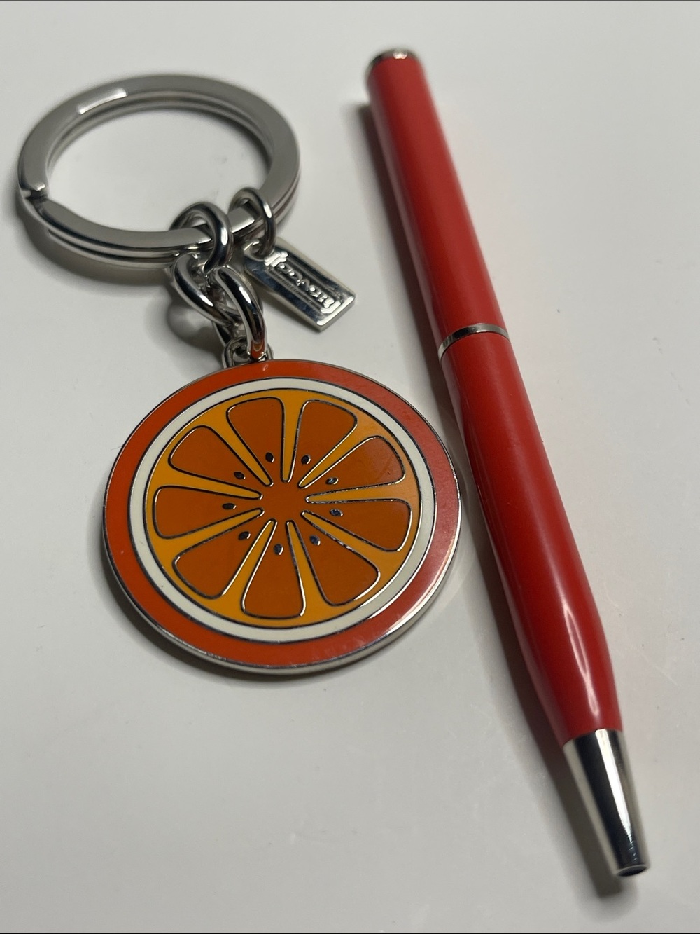 Coach Orange Slice Enamel Keychain and Coach Pen